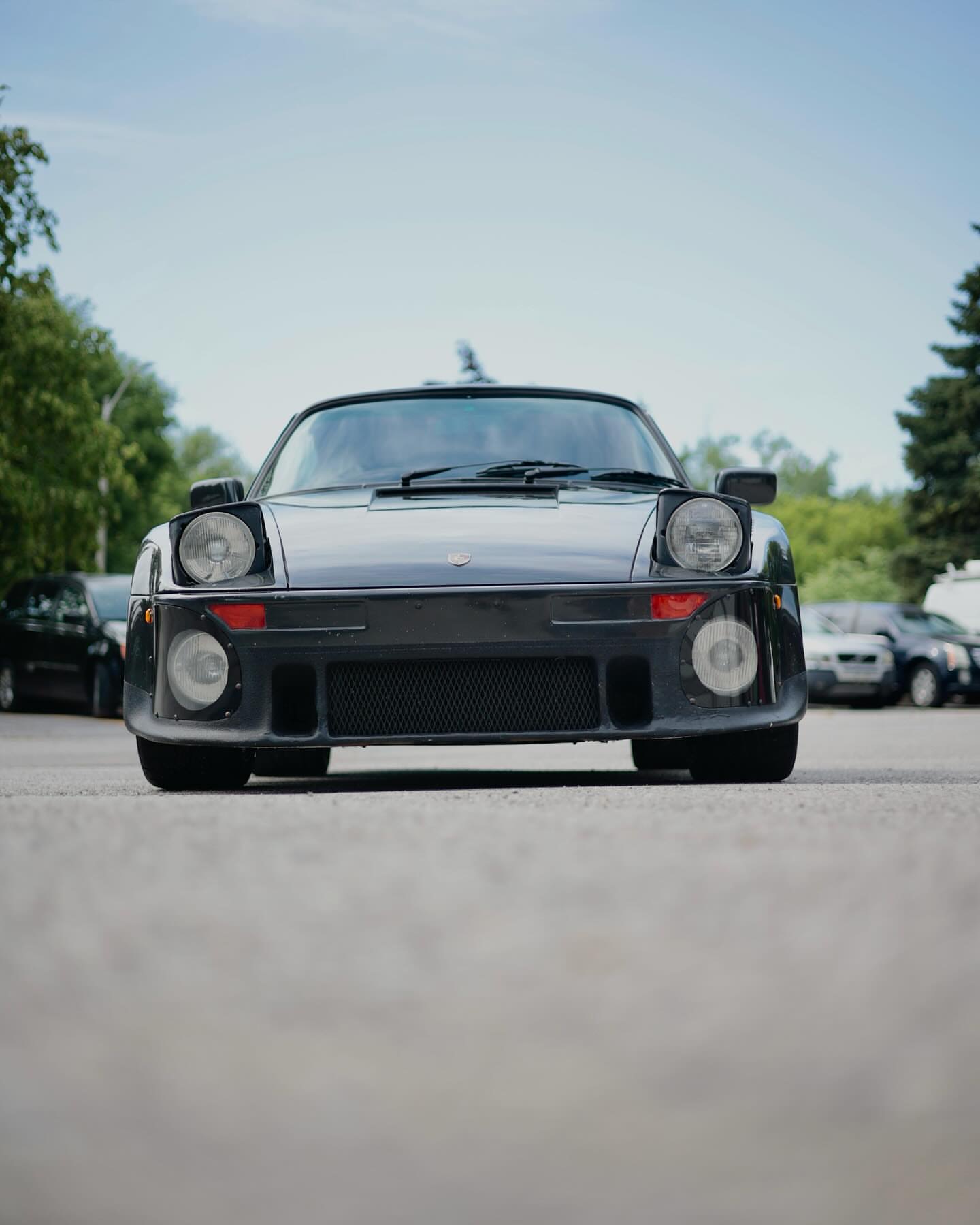 Front view of a black classic Porsche 911 Turbo
