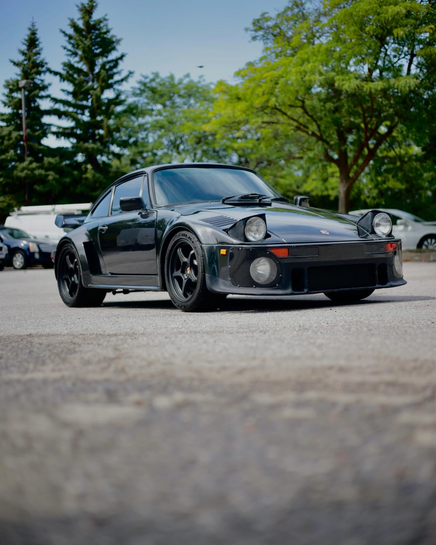 Low angle front shot of a black classic Porsche 911 Turbo