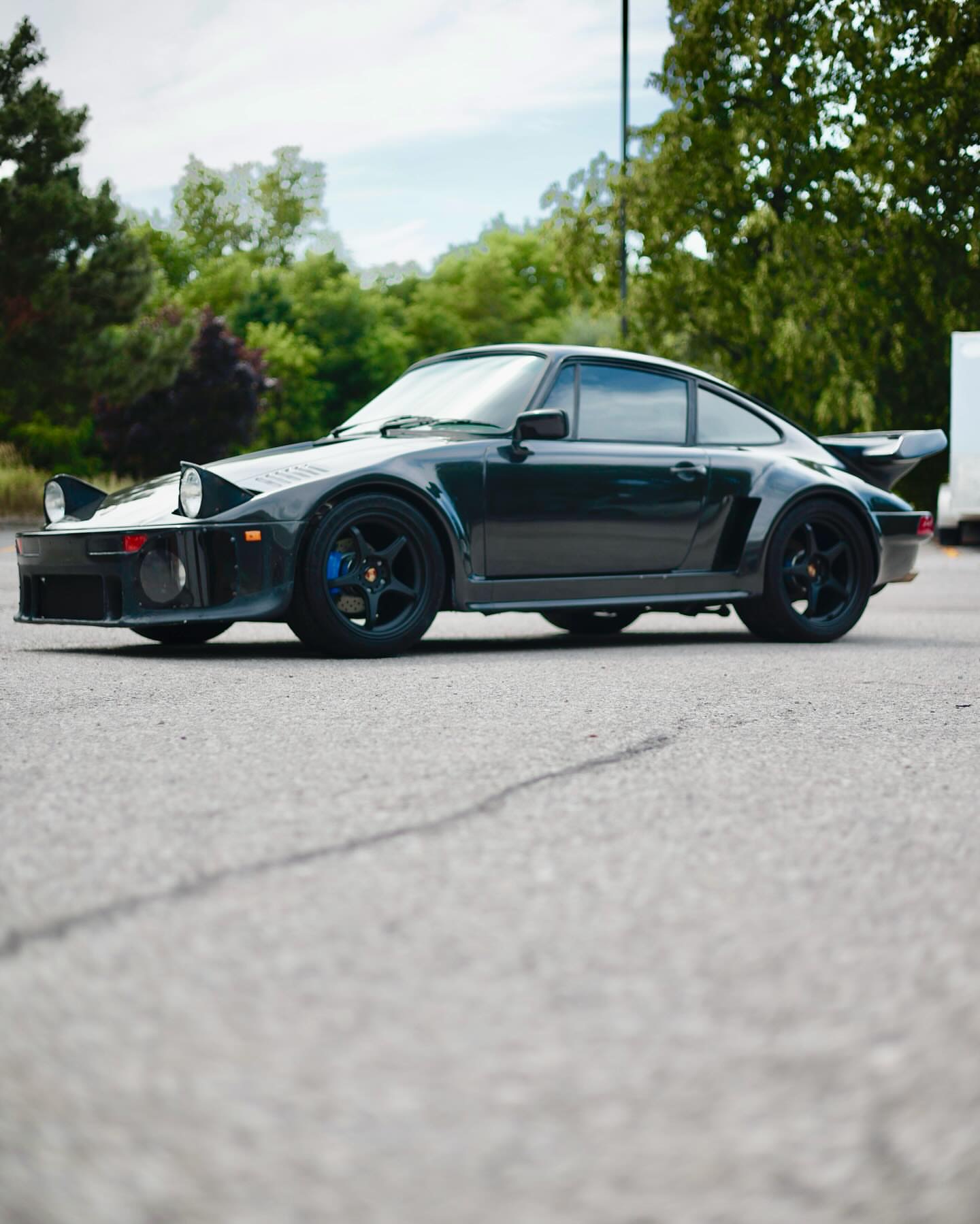 Classic black Porsche 911 Turbo front three-quarter after detailing