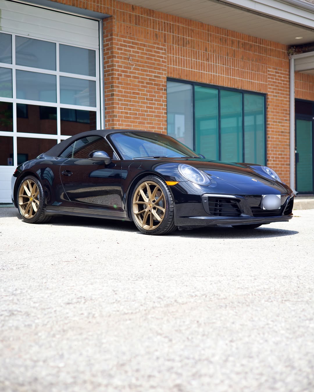 Detailed black Porsche 911 Cabriolet at the studio